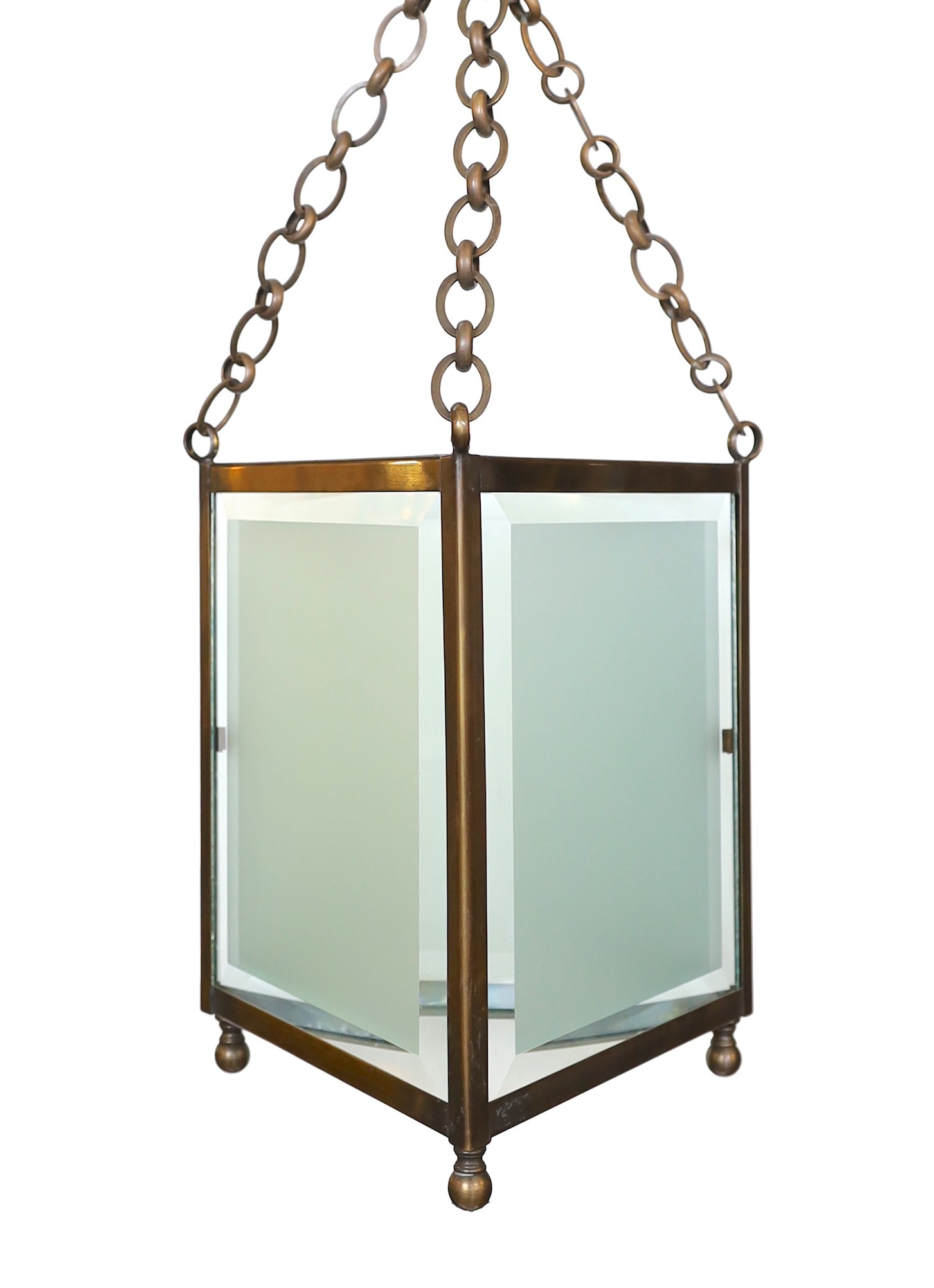 A pair of bronze and frosted glass triangular hall lanterns, height 36cm. width 33cm